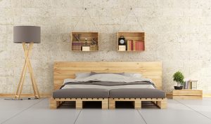 Modern bedroom with bed pallet on brick wall